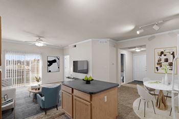 An open kitchen and dining area with a kitchen island.